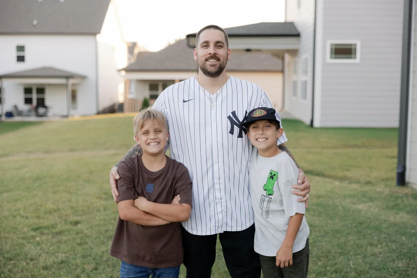 The family behind Raschke & Sons Electric, together outside their home